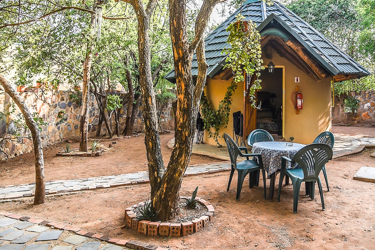 Hotel Mokolodi 2 Botswana nomad remote c226fd94-a871-4236-b6d1-cb06c18084bb_Area outside Executive Rondavel.v1.v1.jpg